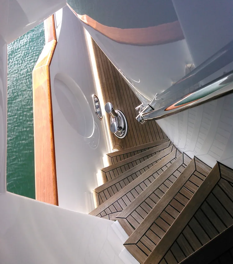 Teak stairs going down to the lower deck